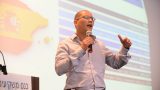 הרצאה בנושא השקעות בספרד - צילום כנס משקיעים טופ אלפא